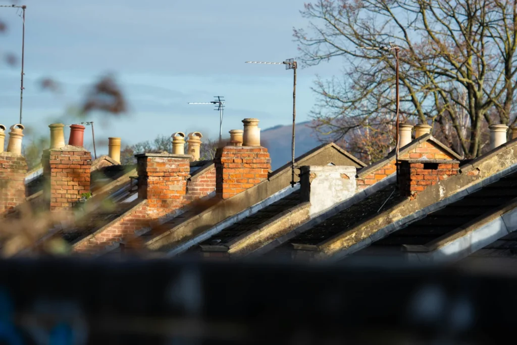 Row of chimneys on top of a brick building, representing UK homeowners whose mortgage deal is ending