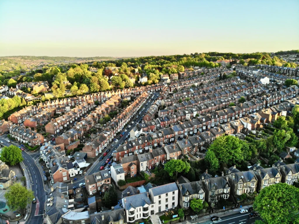 Aerial view of a city with lots of houses, representing UK homeowners seeking mortgage renewal help