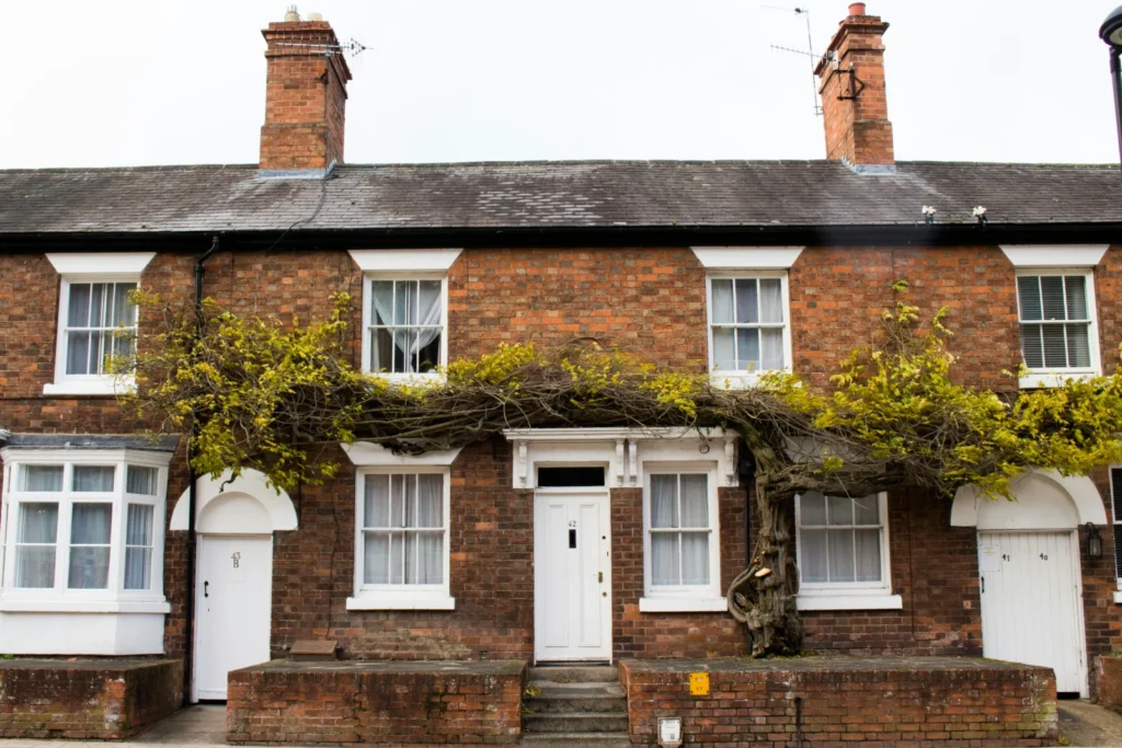 Brown concrete two storey house, a typical home facing the product transfer or remortgage decision