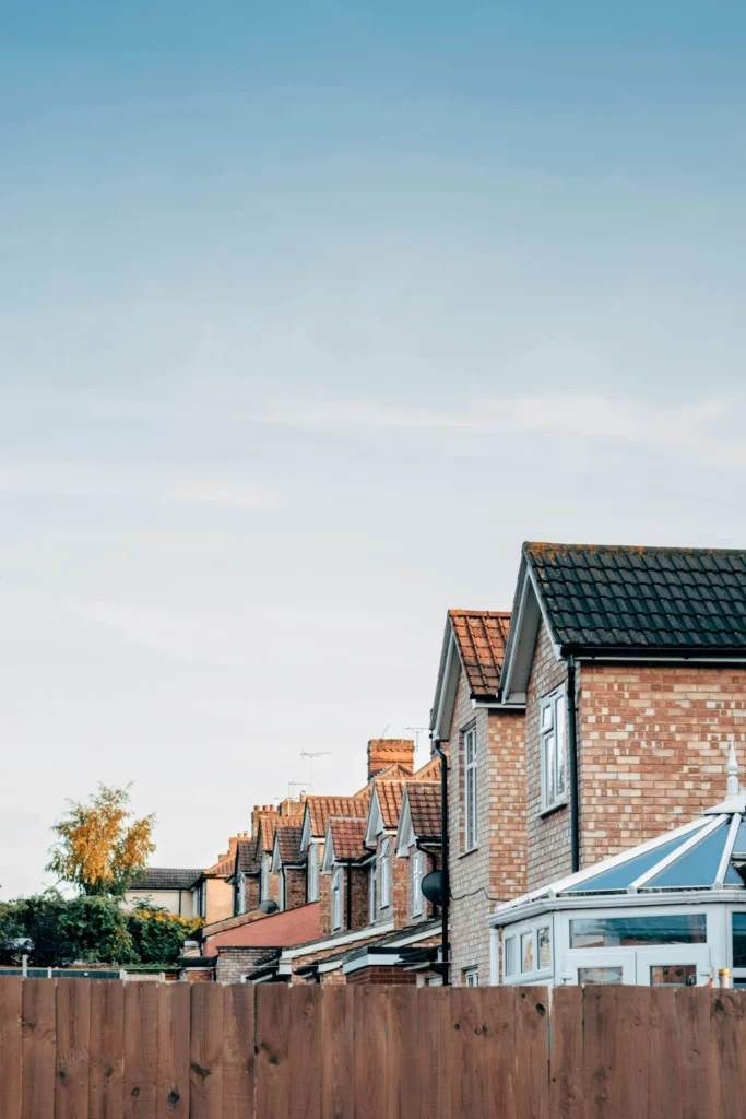 Brown and white concrete houses under a white sky, UK homes facing a product transfer or remortgage choice